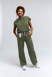 Person wearing a green outfit with a white background